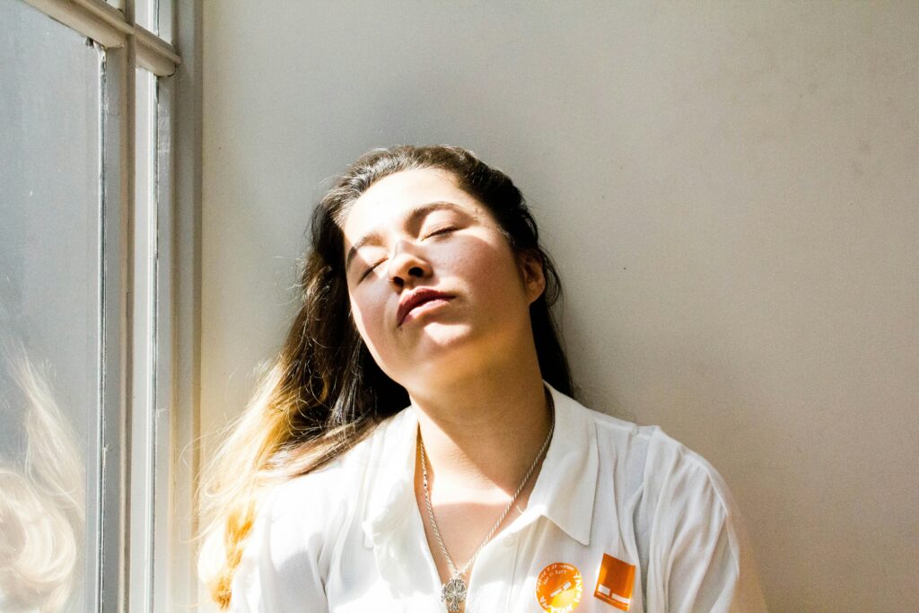girl lacking energy to accompany the article New Year Burn-out: A Wake-up Call to Feminine Magic and Your Self Healing Apothecary by Nicole Barton